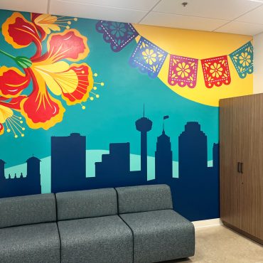 San Antonio skyline mural in SKG Texas employee breakroom